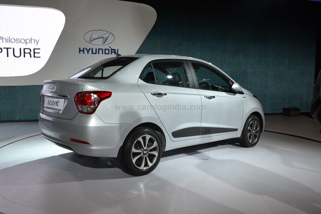 http://www.carblogindia.com/wp-content/uploads/2014/02/2014-Hyundai-Xcent-Rear-Left-Quarter.jpg