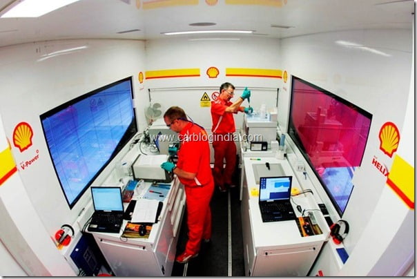 Shell Trackside Analyst Mark æCharleyÆ Farley and Formula One Project Manager Ian Albiston at work in Shell Trackside Laboratory. German Grand Prix. 24 July 2005