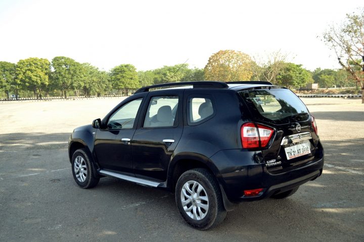 Nissan-Terrano-Petrol-Review-Images-Black-Rear-Angle-Action