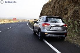 maruti vitara brezza review images rear angle silver