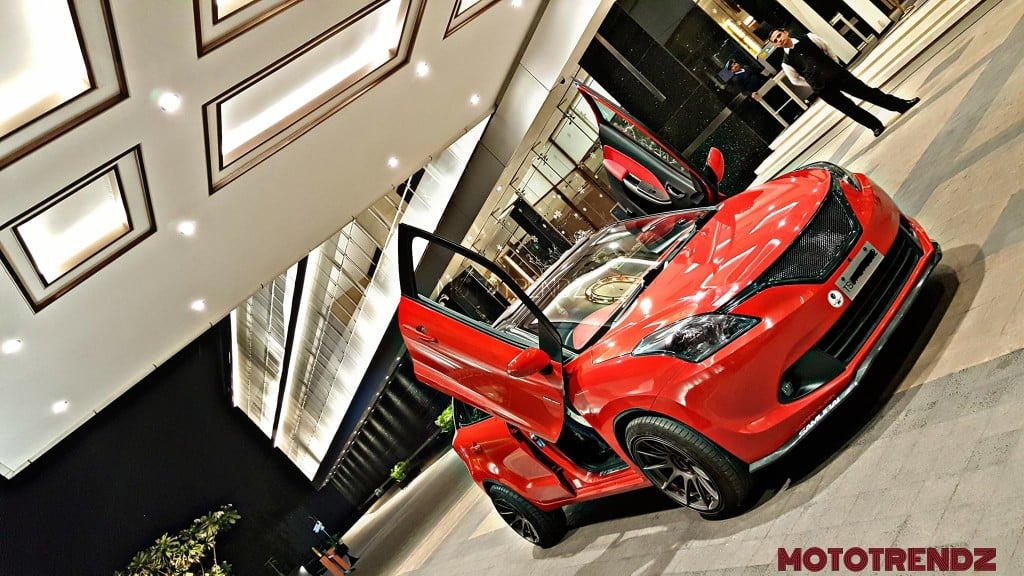 modified maruti baleno scissor doors red images