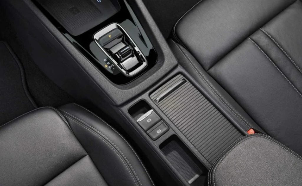 The gear lever in the centre console has been replaced with a rocker switch arrangement for shifting gears for a more minimalistic look. 