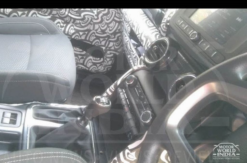 This earlier spy shots of the interiors of the next-gen Mahindra Thar shows you the manual counterpart.