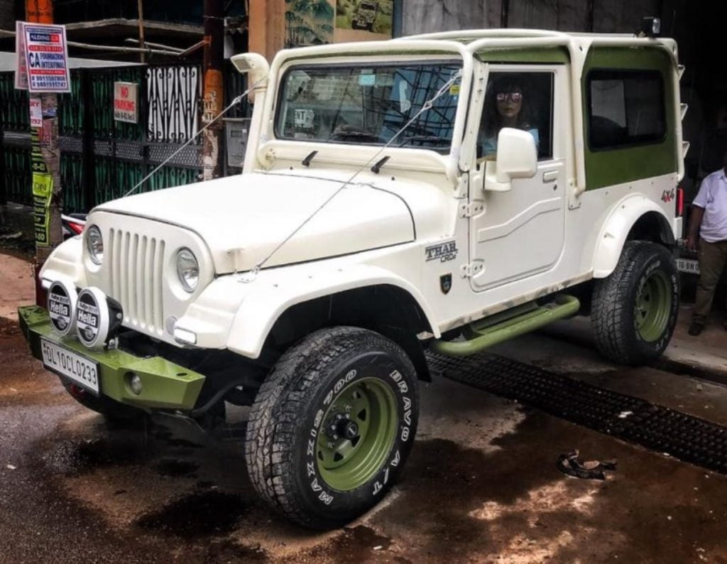 This tastefully modified Mahindra Thar looks really cool with a off-white and olive green paint job. 