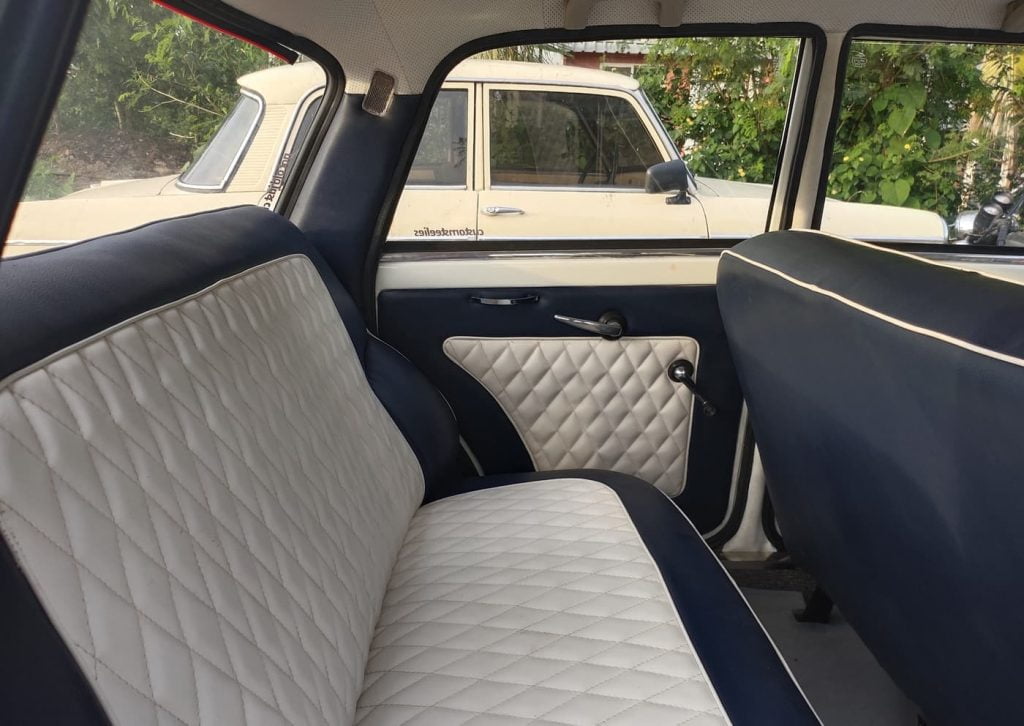The seats and door panels gets white and blue upholstery with diamond pattern stitching. 