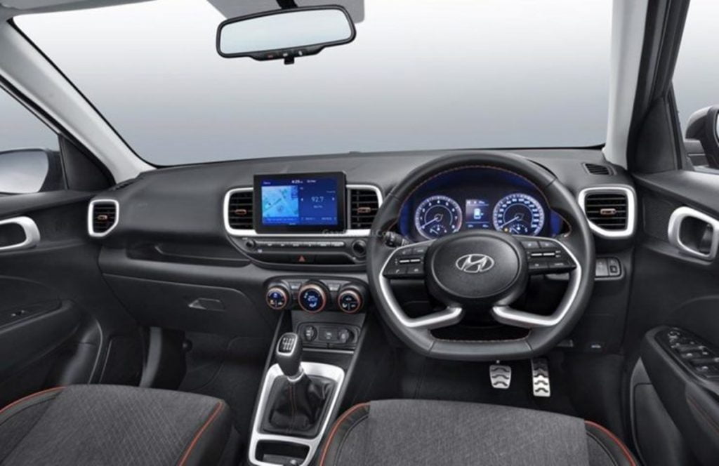 The Venue Sport gets new dark grey upholstery with red stitching and also a steering wheel from the Creta. 