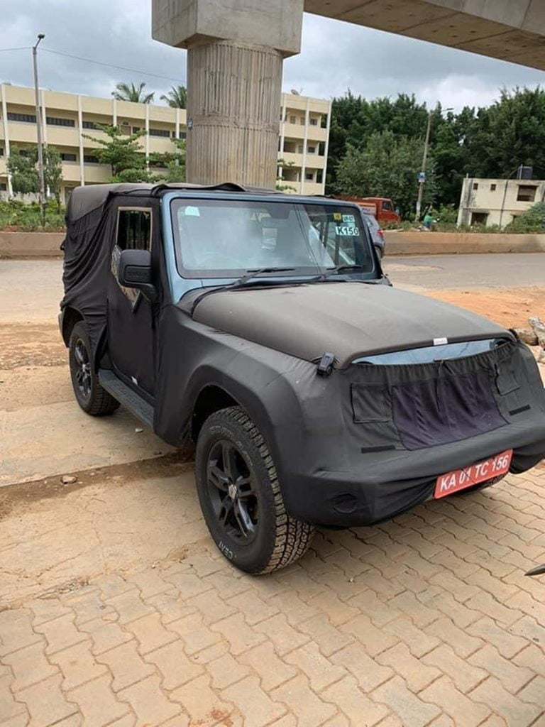 Although most of the  SUV is heavily wrapped, it still reveals some very interesting details about the next-gen Mahindra Thar. 