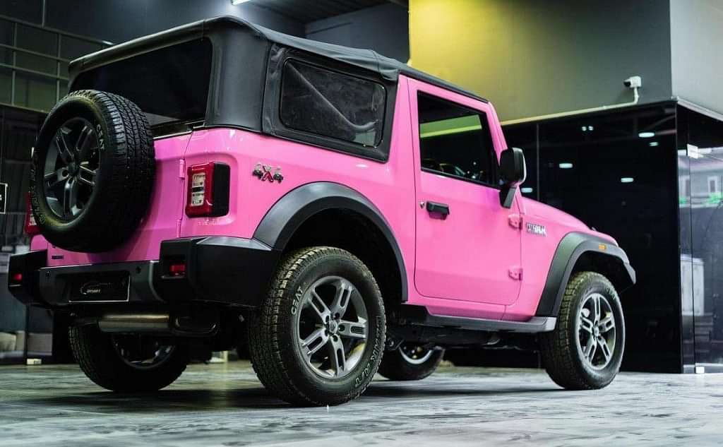 pink mahindra thar rear three quarters