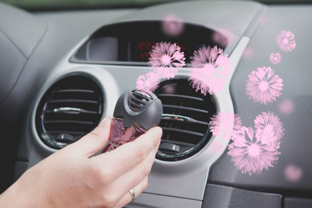 Car air freshener mounted to ventilation panel, fresh flower scent