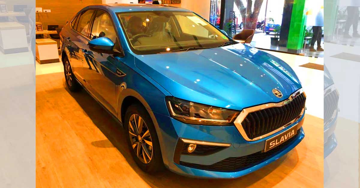 skoda slavia dealership front side profile blue