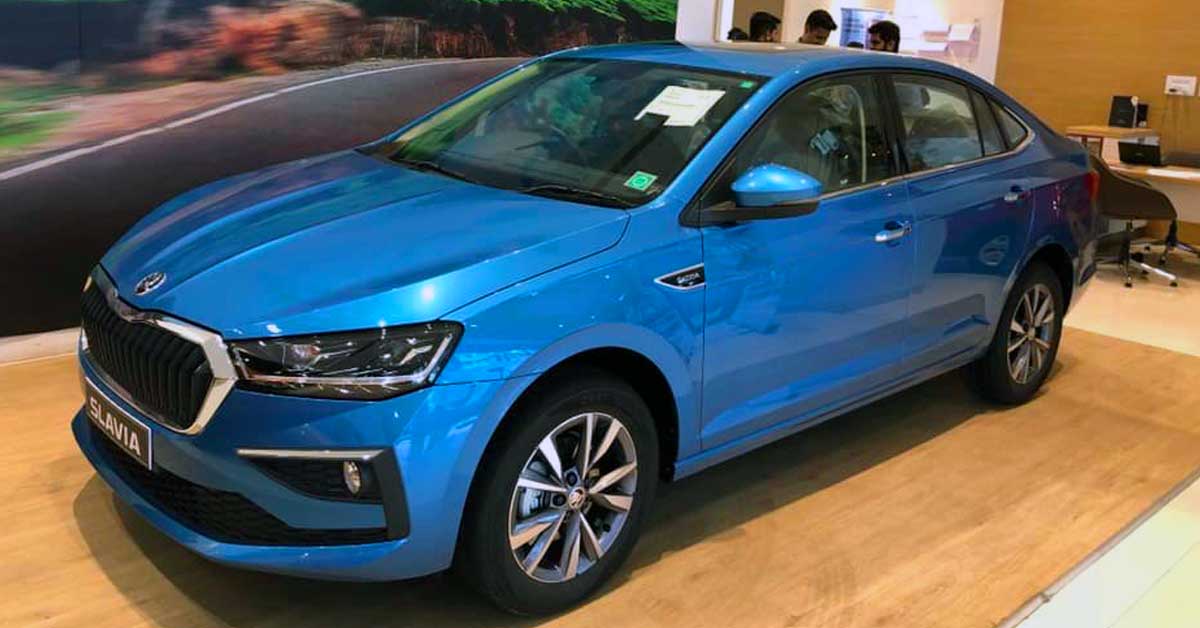 skoda slavia dealership front side profile blue