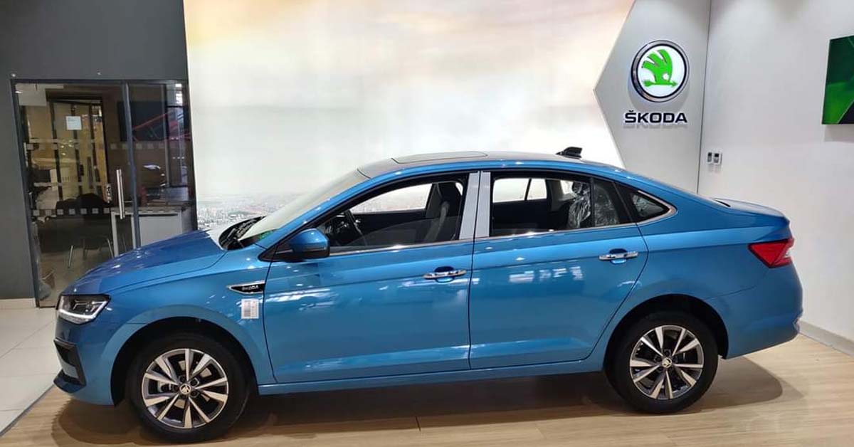 skoda slavia dealership side profile blue