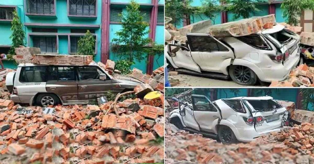brick wall collapses on Mitsubishi Pajero and Toyota Fortuner
