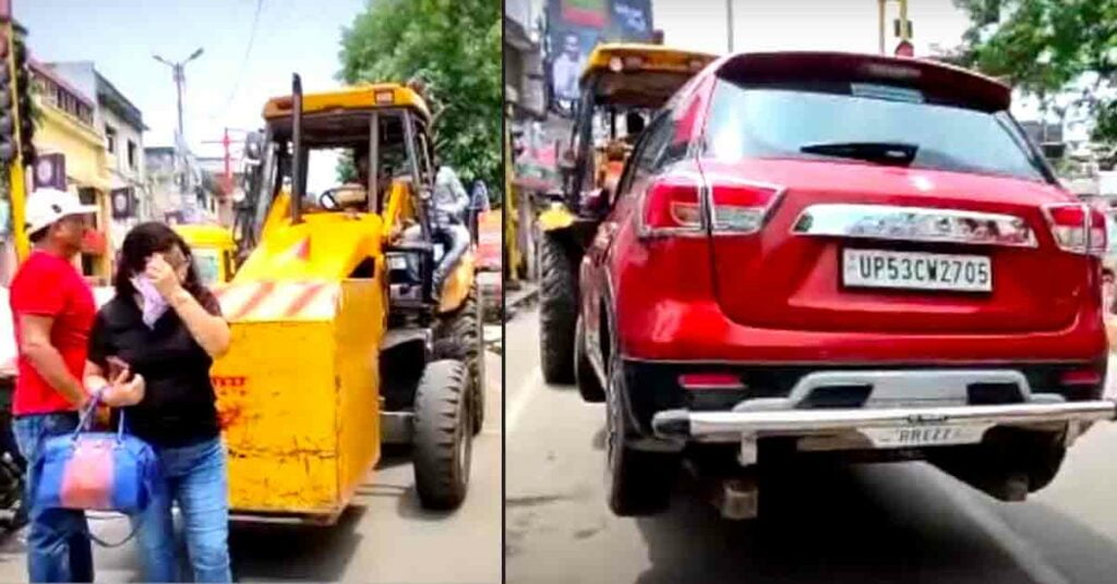 Gorakhpur couple stands it front of the crane to prevent it from lifting its wrongly parked Maruti Brezza