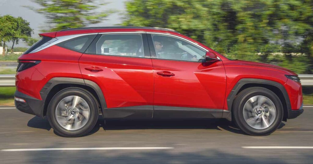 new hyundai tucson fiery red side profile