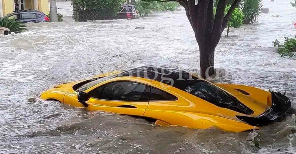 McLaren P1 in a water-logged parking bay due to  Hurricane Ian in Florida