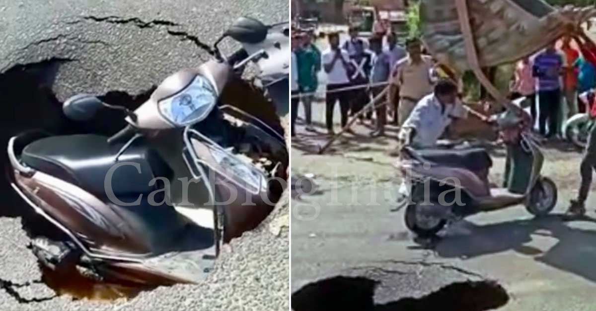 scooter swallowed by pothole