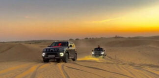 Mahindra Scorpio N driving through desert along with a Toyota Land Cruiser