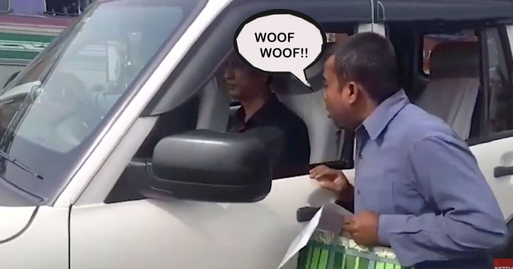 Man barking at Mahindra Scorpio