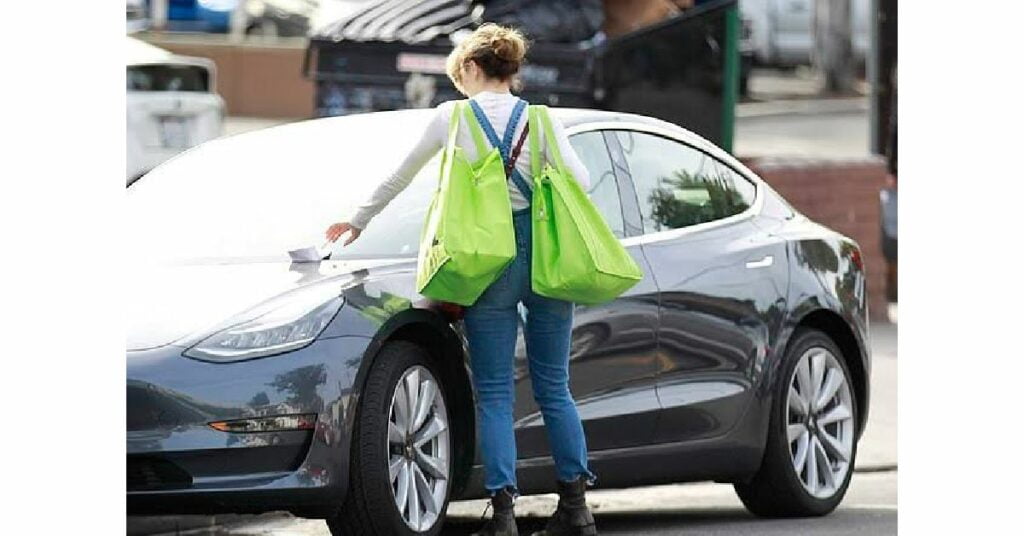 Rachel McAdams with her Tesla Model S