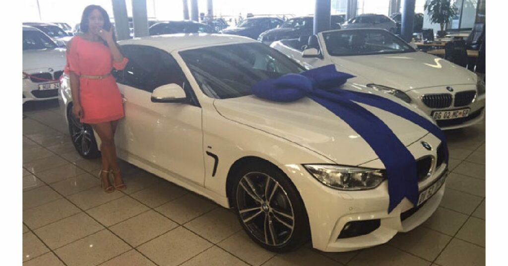 Minnie Dlamini with her BMW 3 Series