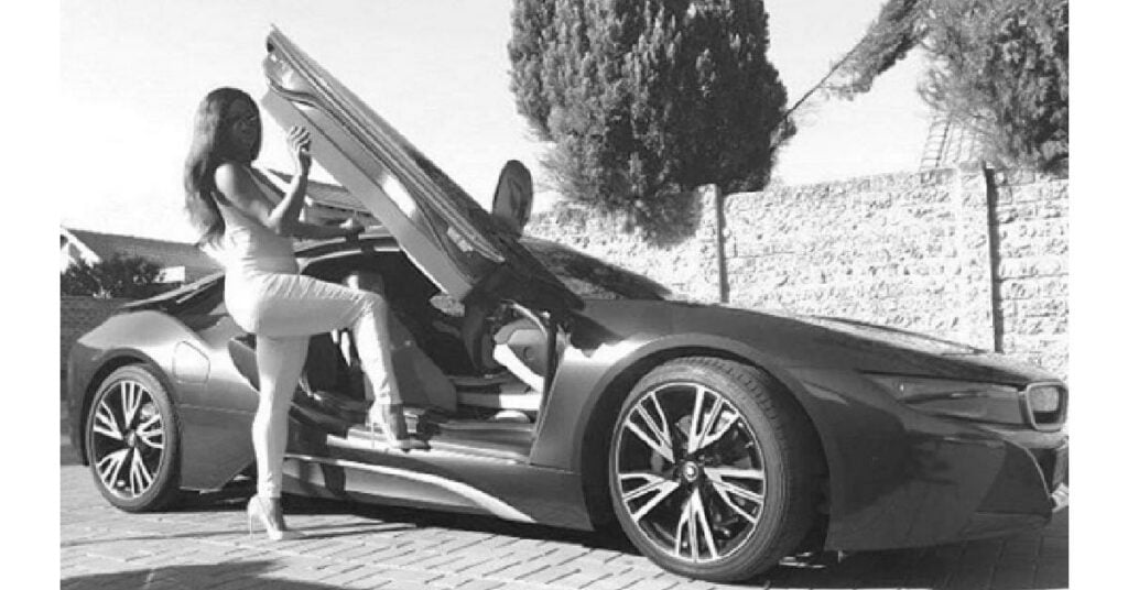 Minnie Dlamini with her BMW i8