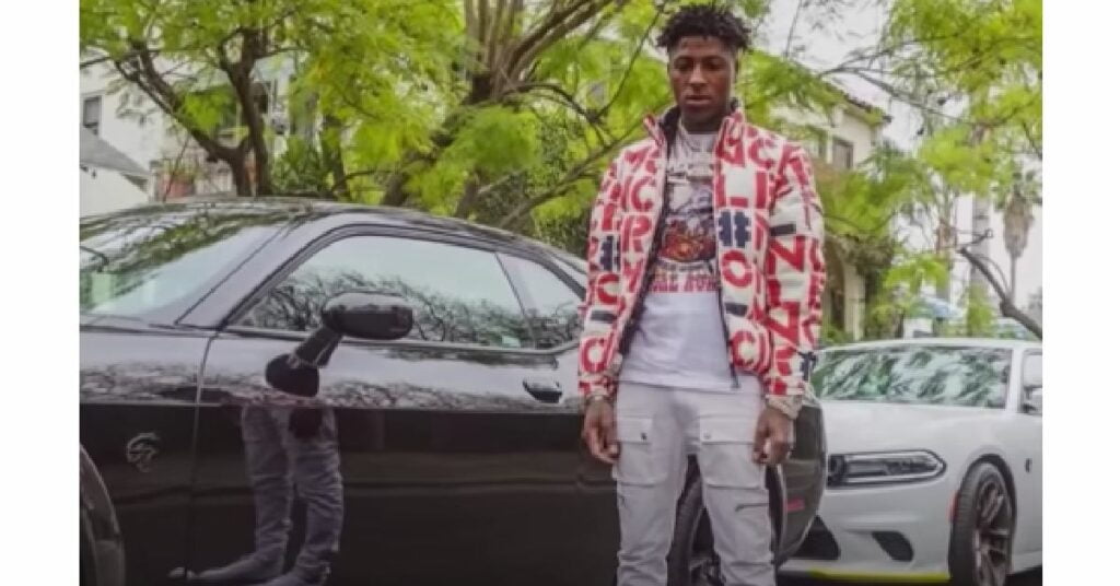 NBA YoungBoy with his Dodge Challenger and Charger Hellcat