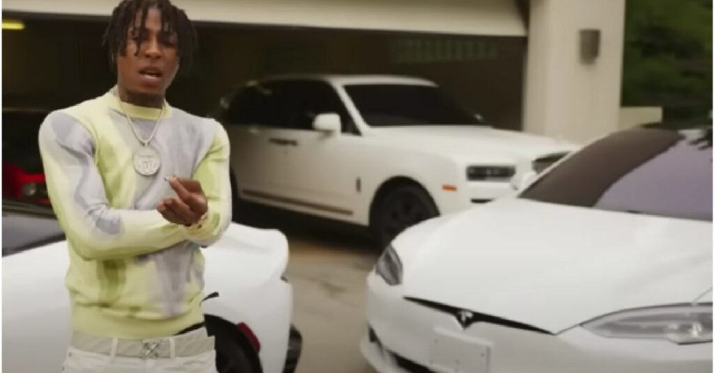 NBA YoungBoy with his Tesla Model S