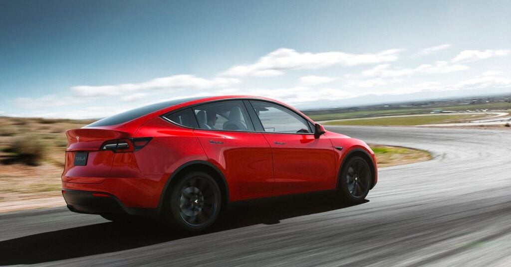 Tesla Model Y red rear three quarters