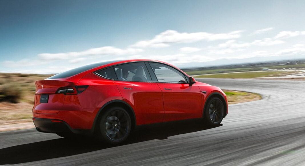 Tesla Model Y red rear three quarters