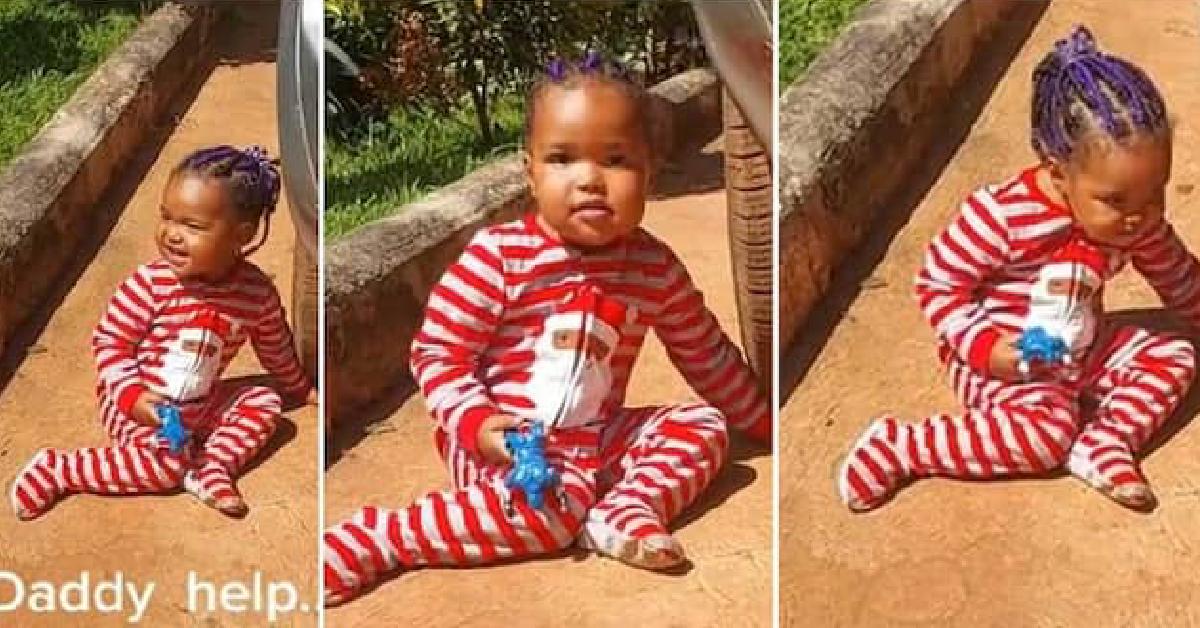 Child Puts Hand Under the Tire of a Car