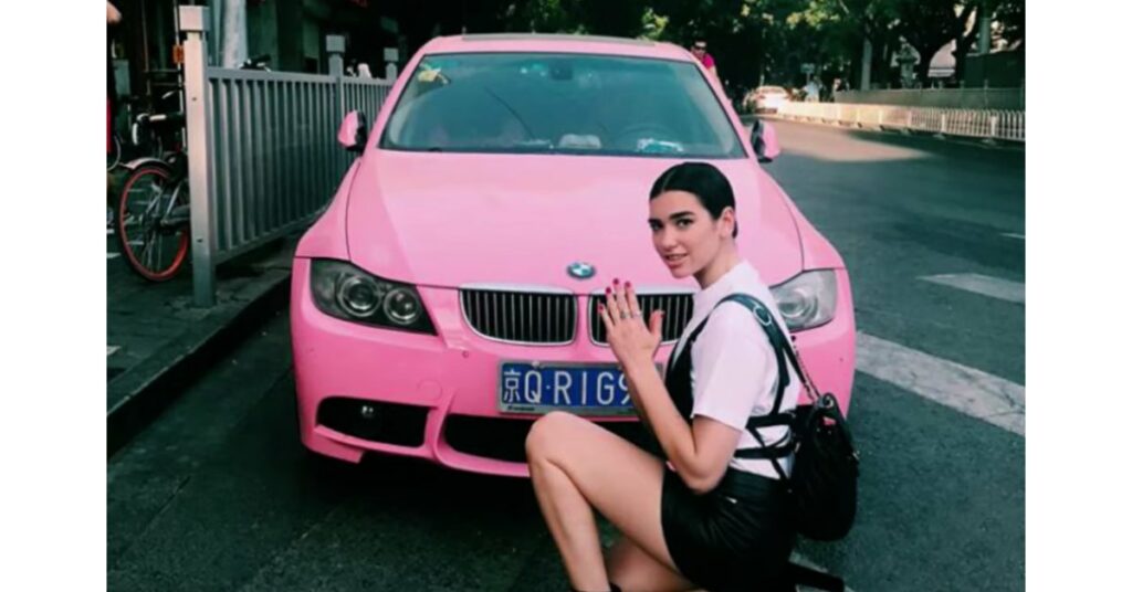 Dua Lipa with her BMW 5 Series