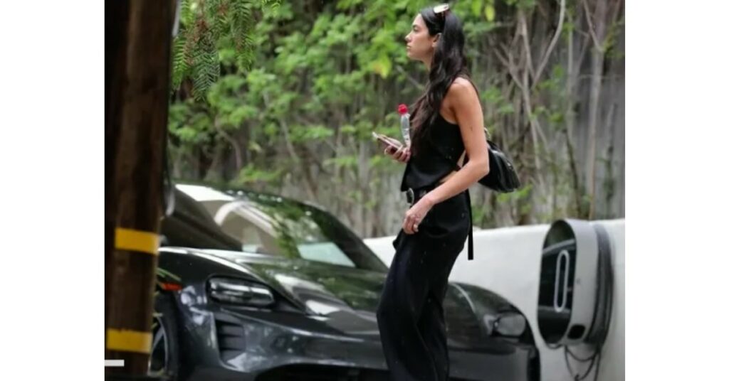 Dua Lipa with her Porsche Taycan