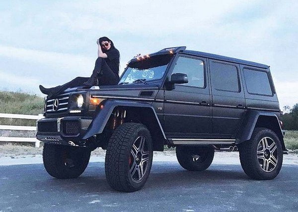Kylie Jenner posing with her Mercedes G Wagon