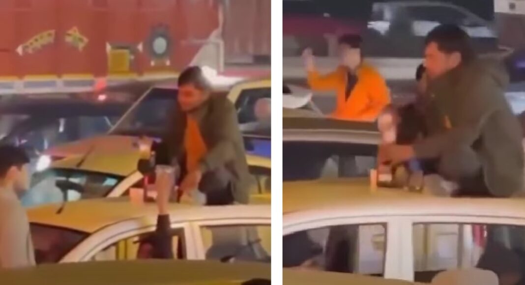 Frustrated by Traffic, Man Starts Drinking on Roof of Moving Car