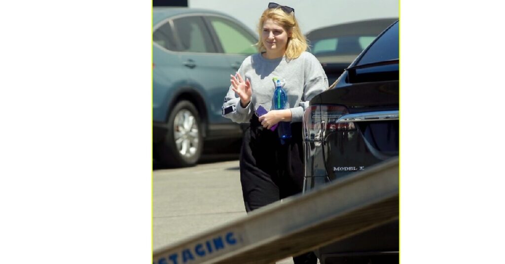 Meghan Trainor with her Tesla Model X