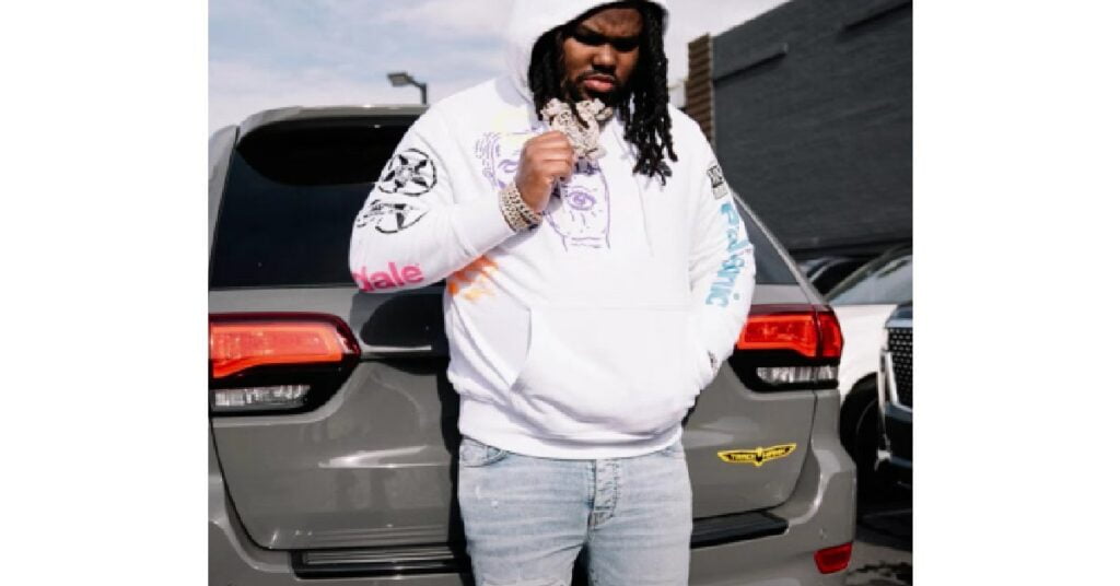 Tee Grizzley with his Jeep Grand Cherokee Trackhawk