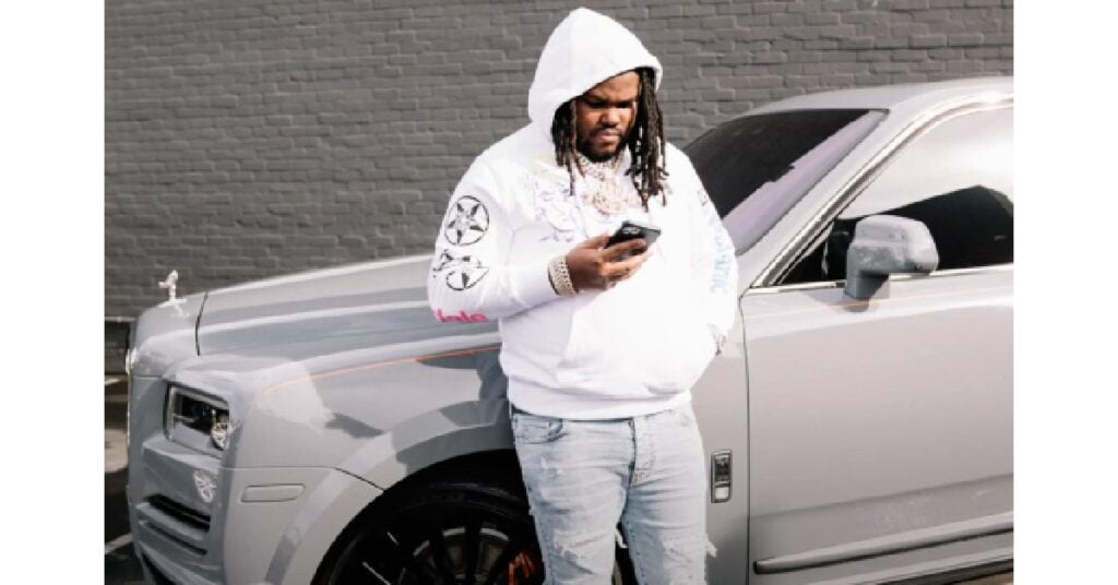 Tee Grizzley with his Rolls Royce Cullinan