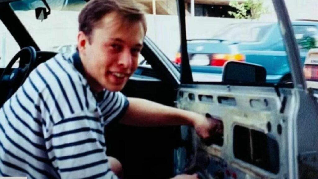 Elon Musk with his BMW 320i