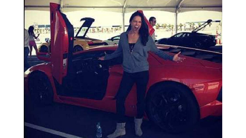 Michelle Rodriguez with her Lamborghini Aventador