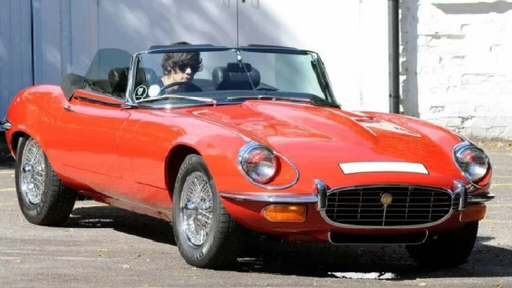 Harry Styles with his Jaguar E-Type Roadster