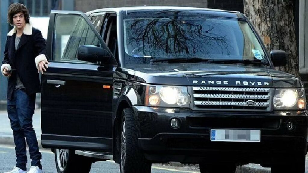 Harry Styles with his Land Rover Range Rover SVR