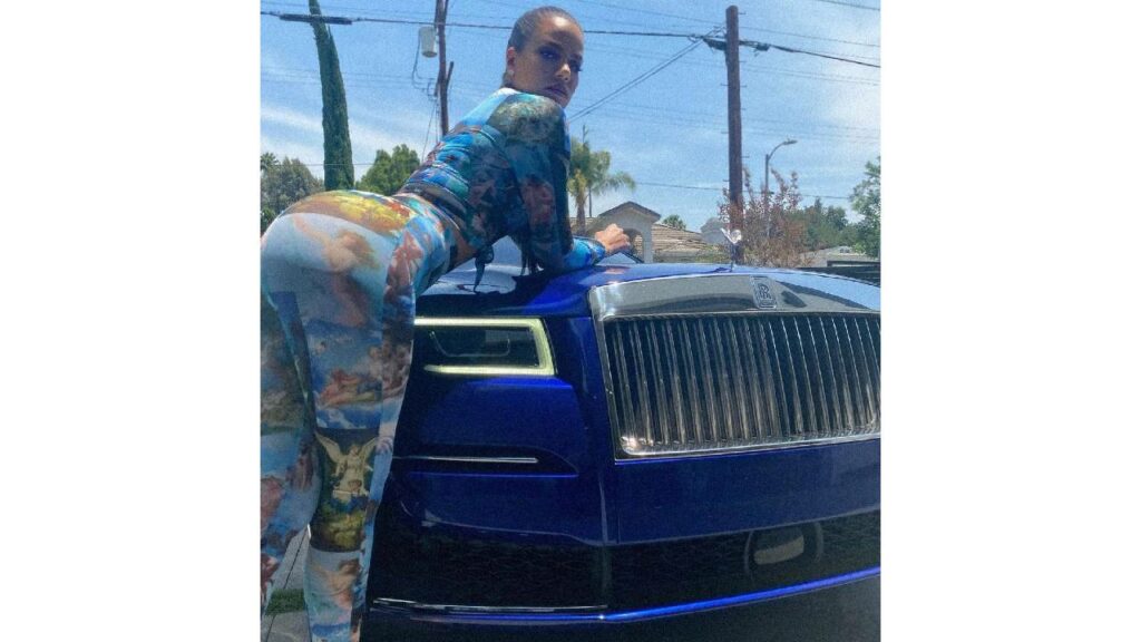 Khloe Kardashian with her blue Rolls Royce