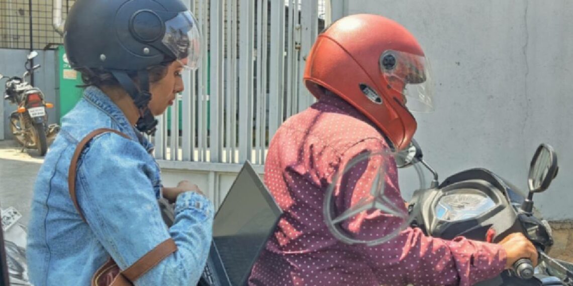 Bangalore Woman Working on Laptop in Traffic