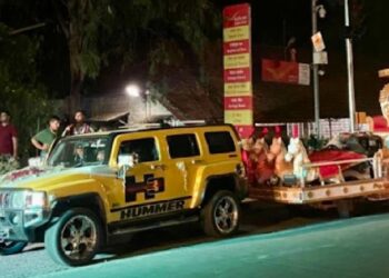 Hummer Pulling Marriage Stage on Road in India