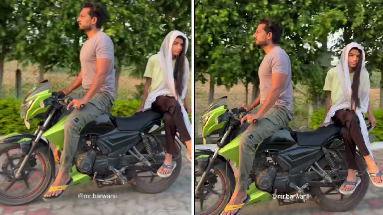 Man Rides Bike While Sitting on Fuel Tank