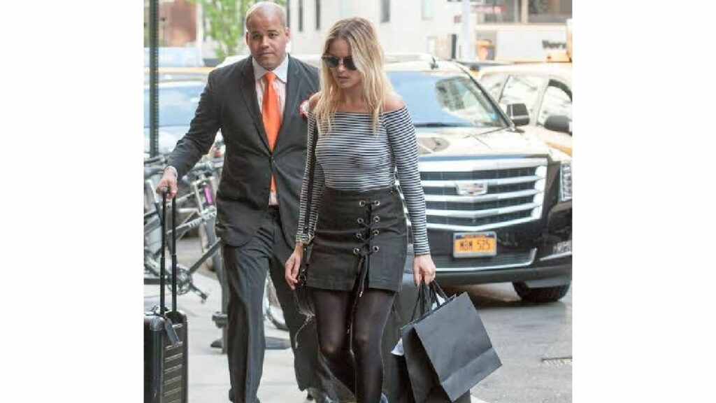 Margot Robbie with her Cadillac Escalade