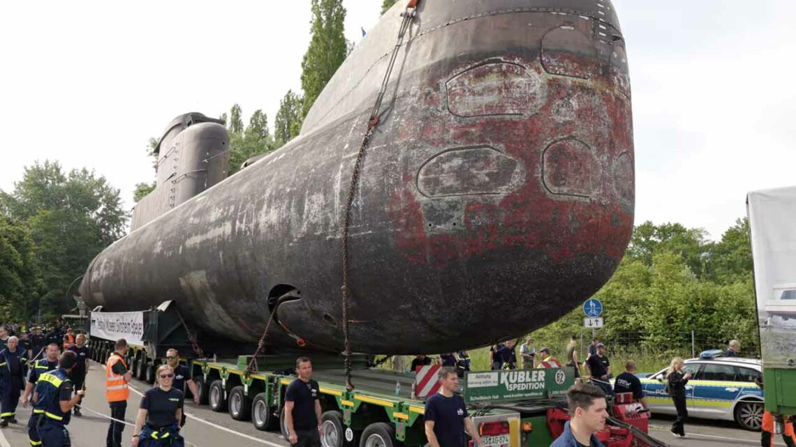 4 Trucks Pull Submarine in Germany