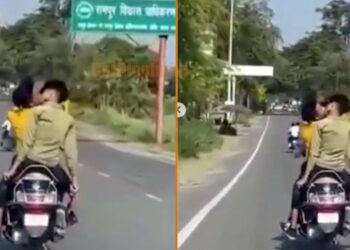 Two Boys Kissing on Moving Scooty