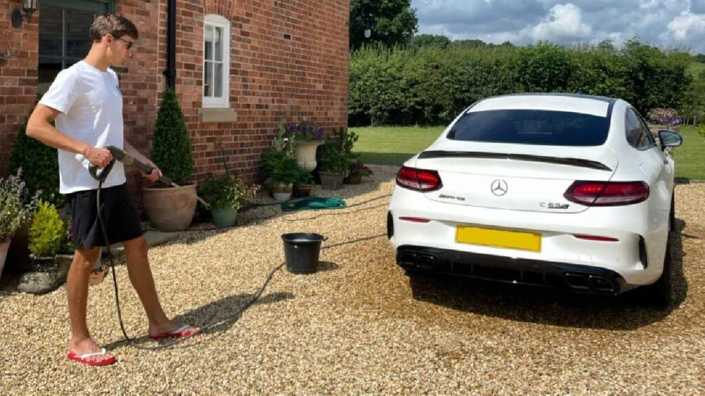 George Russell with his Mercedes AMG C63 S Coupe